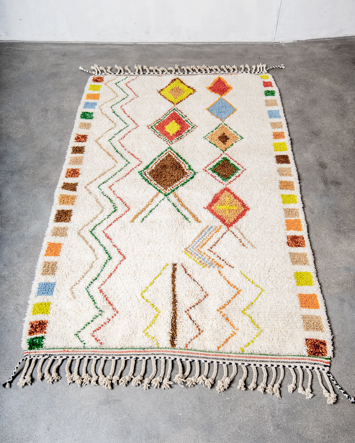 Modern, designer, handcrafted Berber rug from Morocco. Beniourain carpet with beautiful colours and patterns and fluffy wool texture.